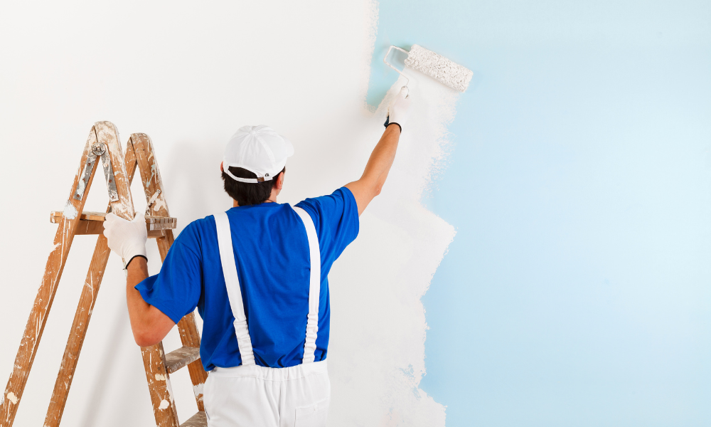 painter painting with paint roller